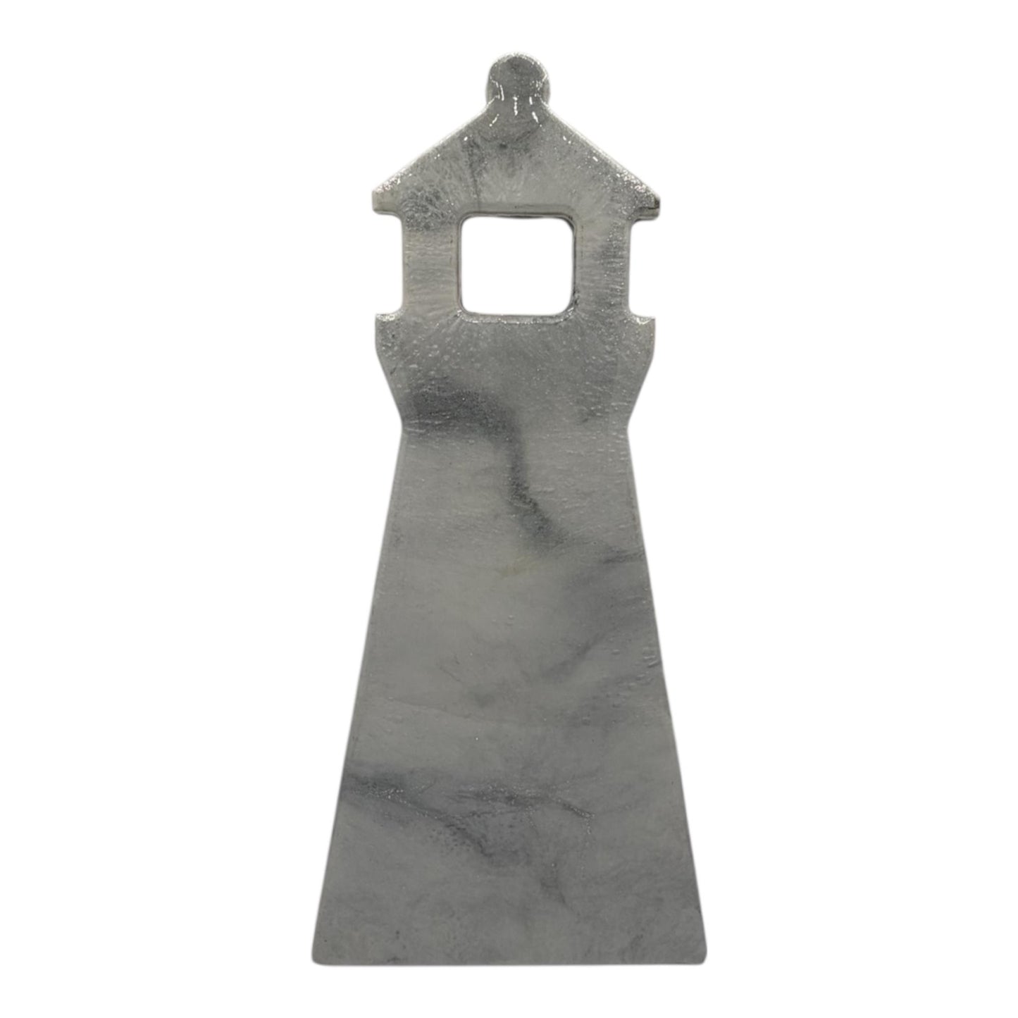 A resin wall decor in the shape of a lighthouse in soft gray marble-inspired finish with subtle veining