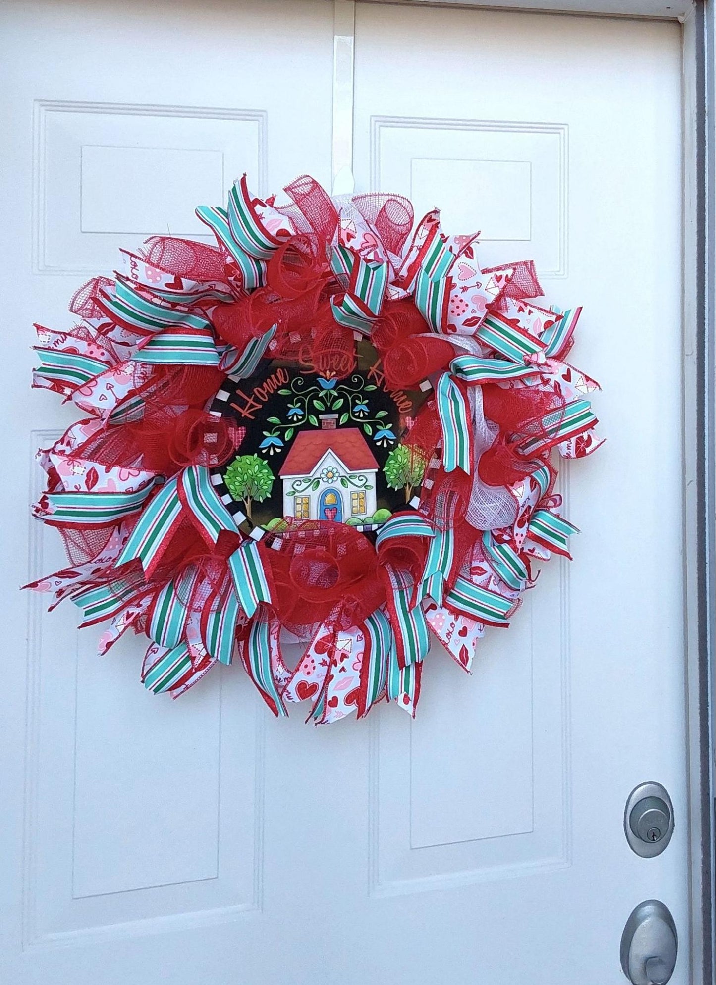 Valentine's wreath with ribbons and mesh with a Home Sweet Home centerpiece