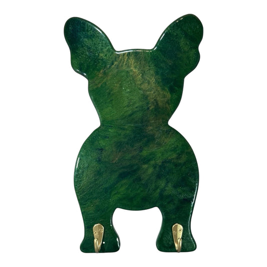 Green marbeled bulldog shaped resin wall art with two gold hooks on the feet.