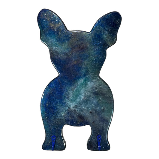 Galaxy blue and metallic swirled resin wall art shaped like a bulldog on a white background.