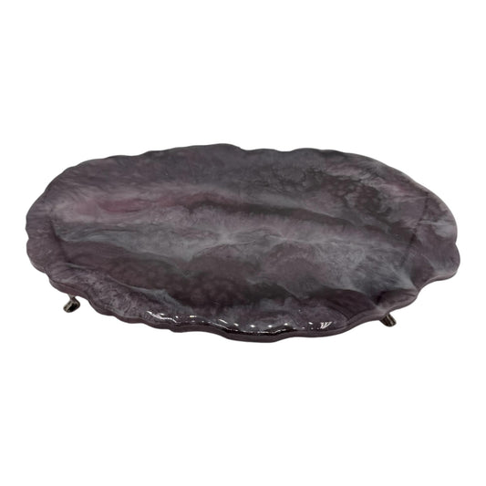 A purple, ovan resin decorative tray on a white background.