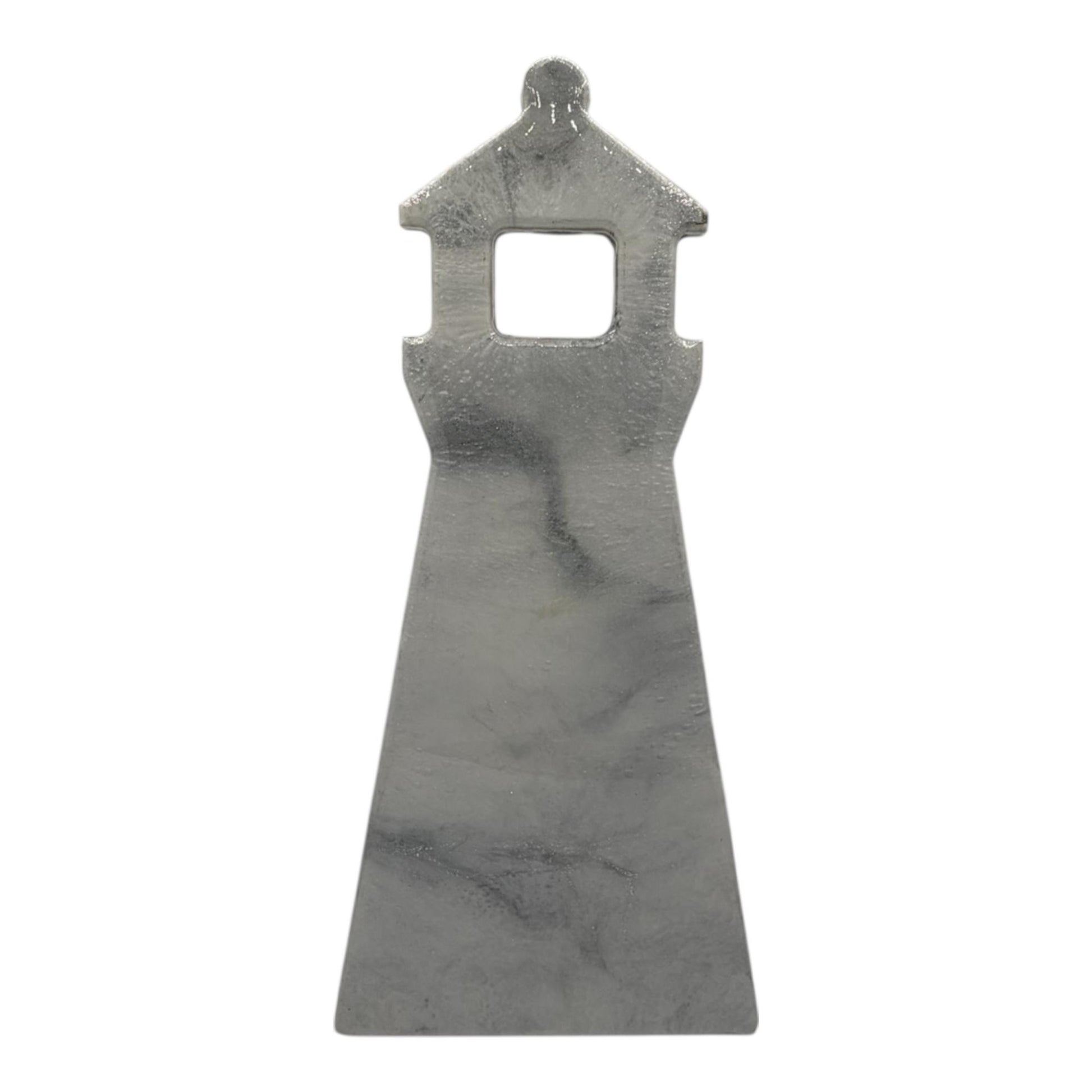 A resin wall decor in the shape of a lighthouse in soft gray marble-inspired finish with subtle veining